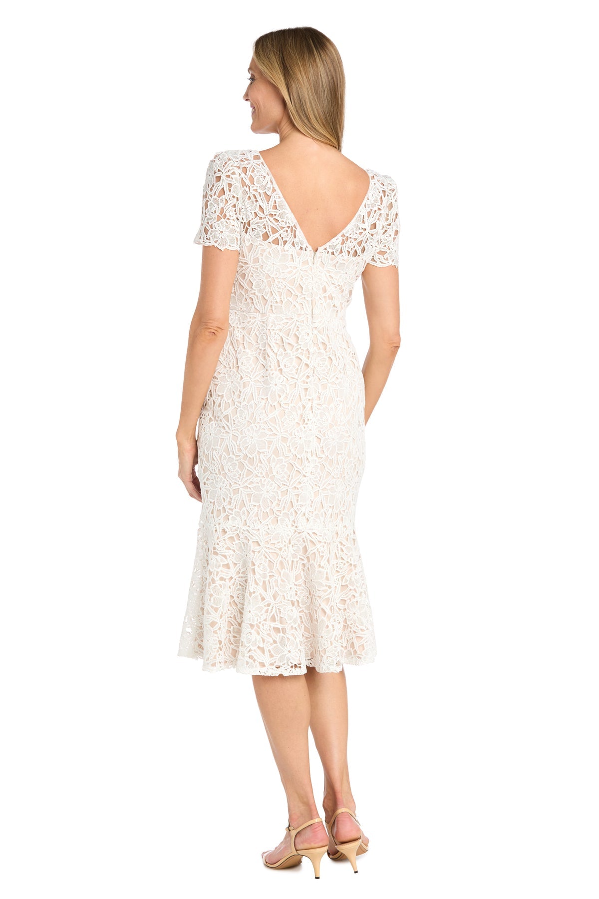 Woman wearing the R&M Richards 3498 Midi Lace Wedding Guest Dress in white, featuring short sleeves and a V-back, standing and facing away from the camera.